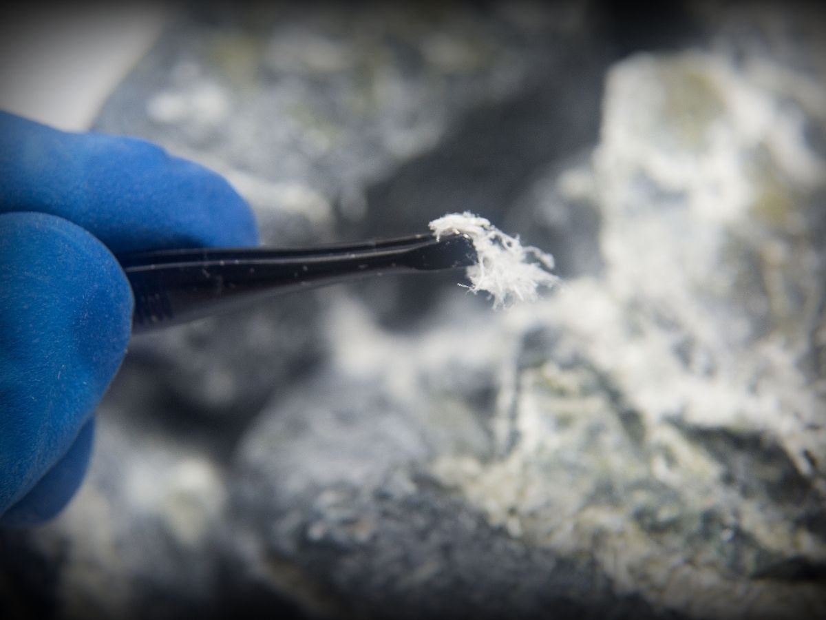 Exposed asbestos material in a building cavity